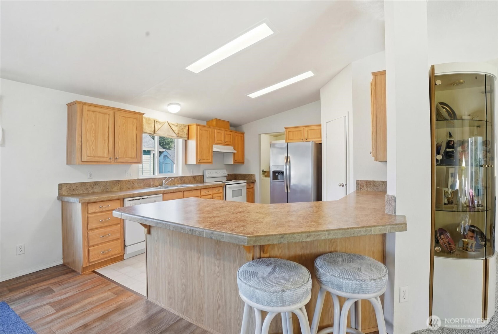 1003 Lord Street Kelso, WA 98626 - Photo 25 of 29 a view of kitchen island a sink wooden floor and living room view