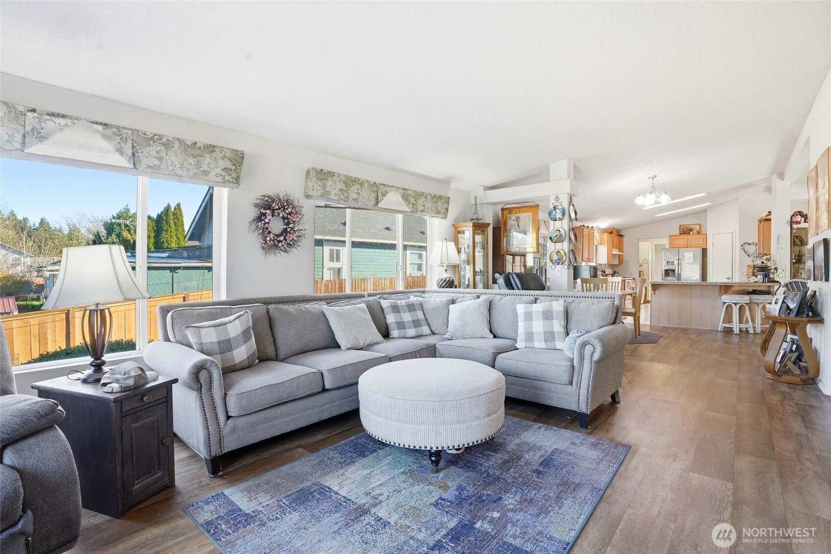 1003 Lord Street Kelso, WA 98626 - Photo 7 of 29 a living room with furniture and a wooden floor