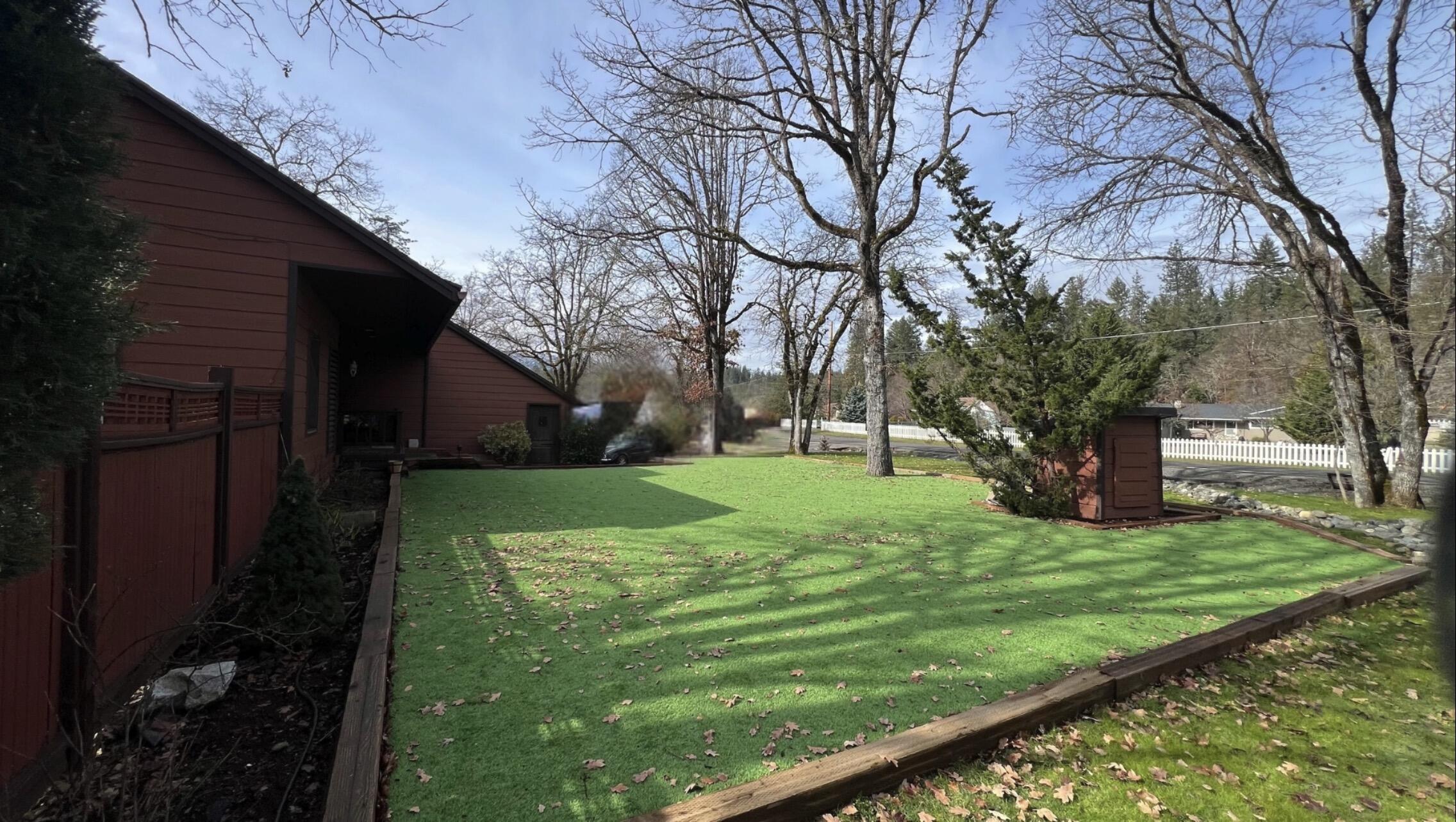 255 Barker Drive Merlin, OR 97532 - Photo 7 of 26 a view of a backyard with large trees