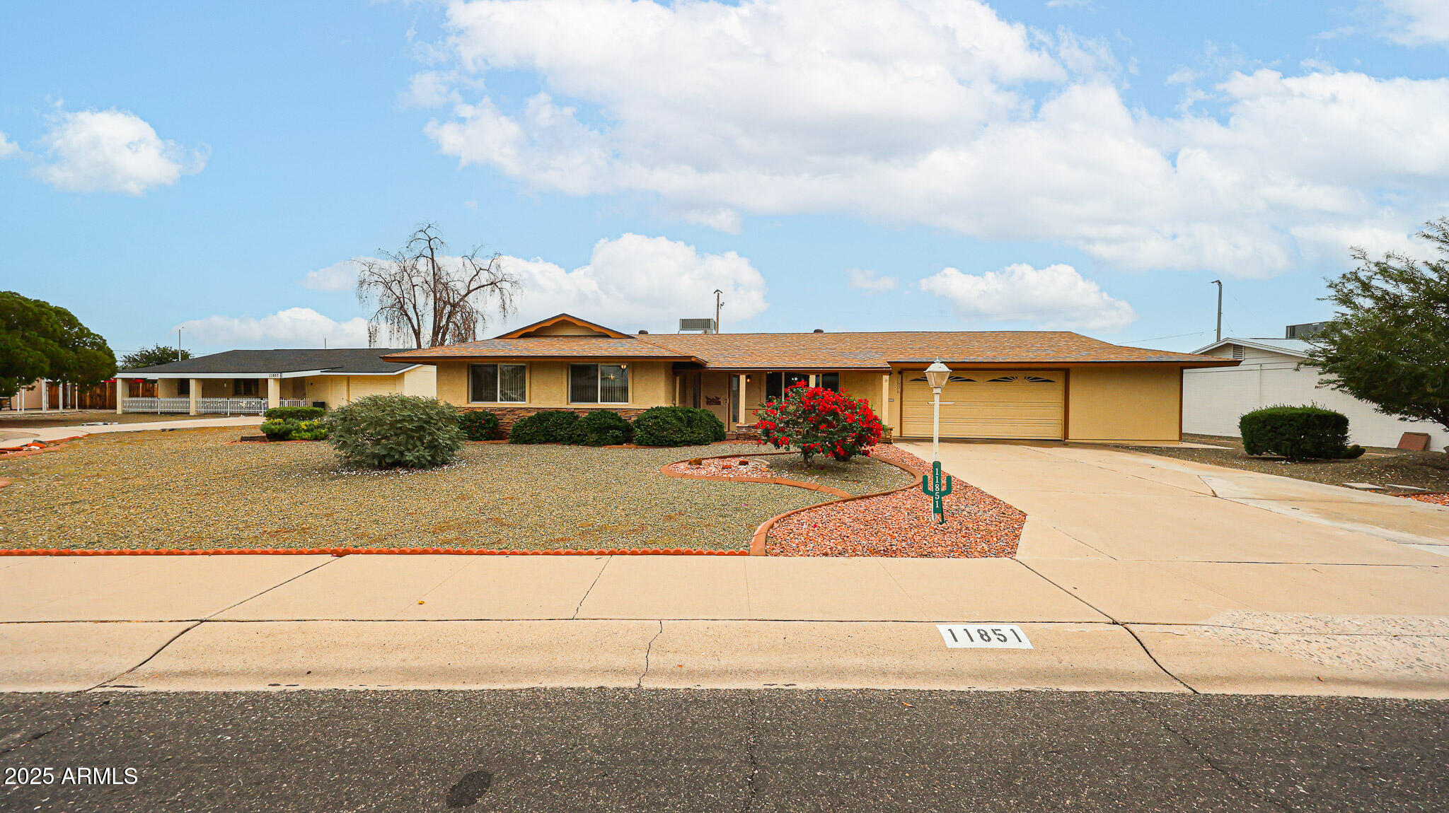 11851 North Thunderbird Road Sun City, AZ 85351 - Photo 4 of 46 a front view of a house with garden