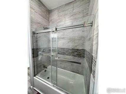 a view of a hallway with windows