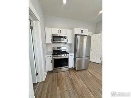 a room with cabinet and a window