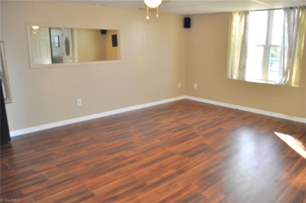 371 Sunset Ridge Lane Lexington, NC 27295 - Photo 17 of 21 Spacious bedroom on lower level with ensuite bath offers many possibilities-- gameroom or private area for guests, inlaws or teenagers.