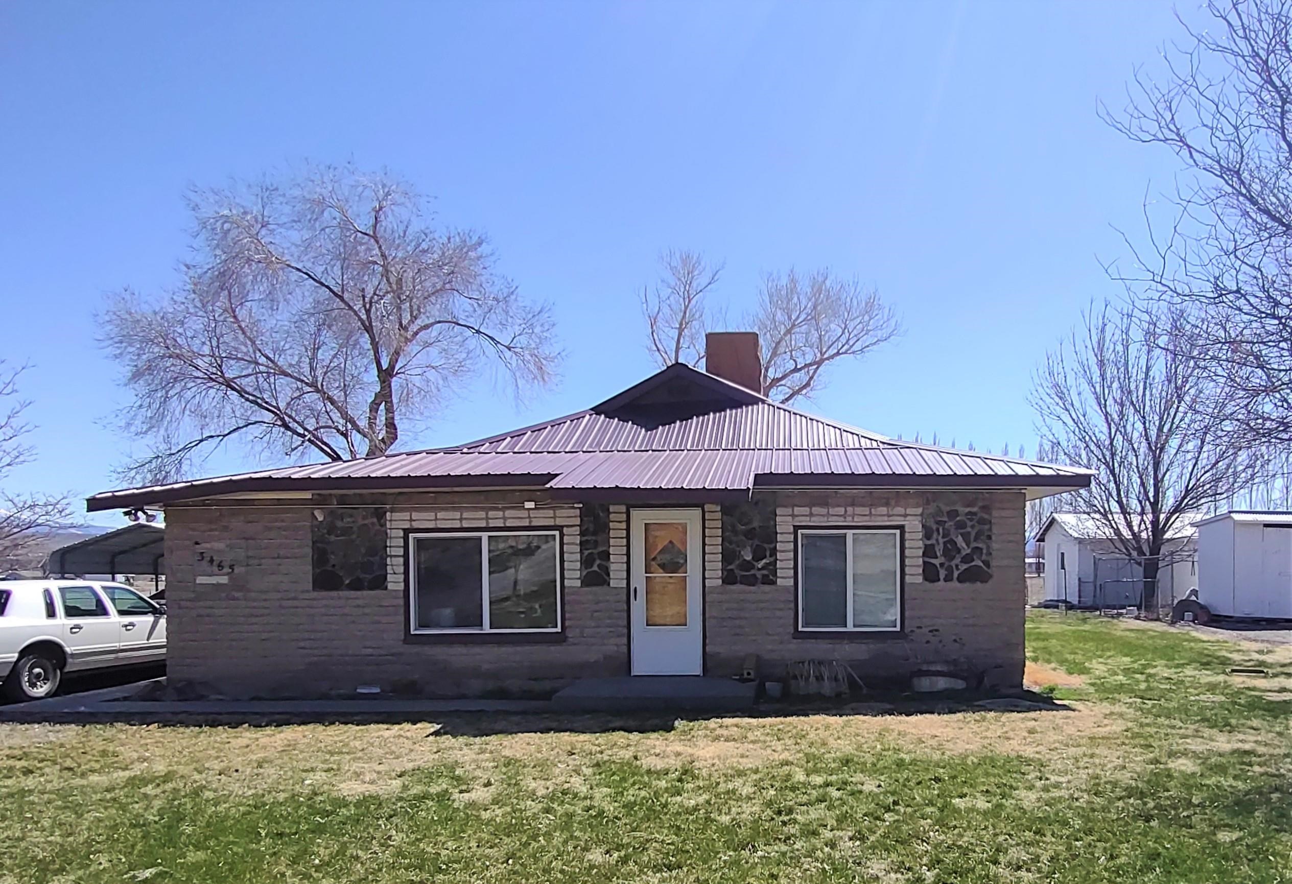3465 G Road Clifton, CO 81520 - Photo 1 of 18 a front view of a house with a yard