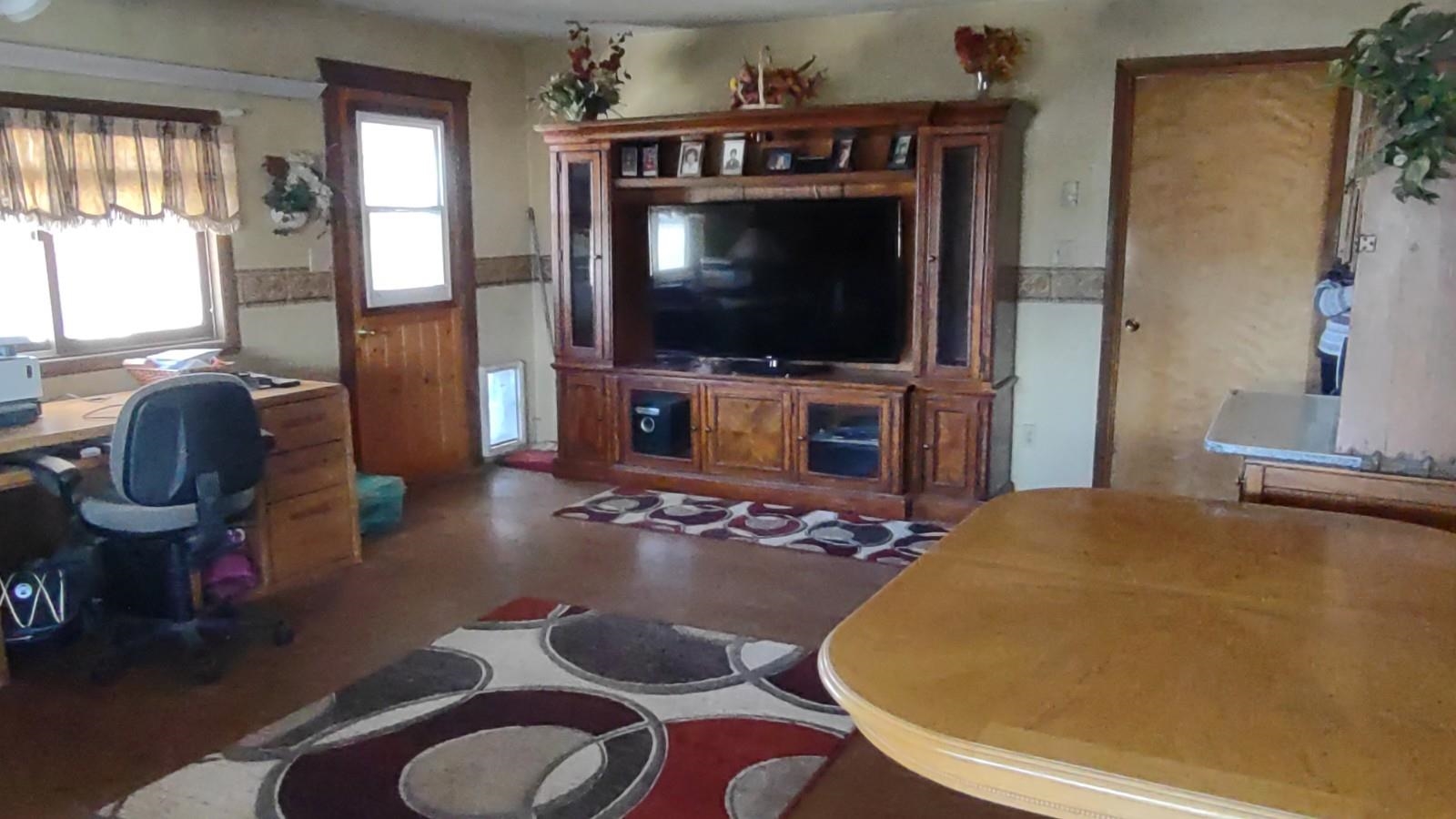 3465 G Road Clifton, CO 81520 - Photo 2 of 18 a living room with furniture and a flat screen tv