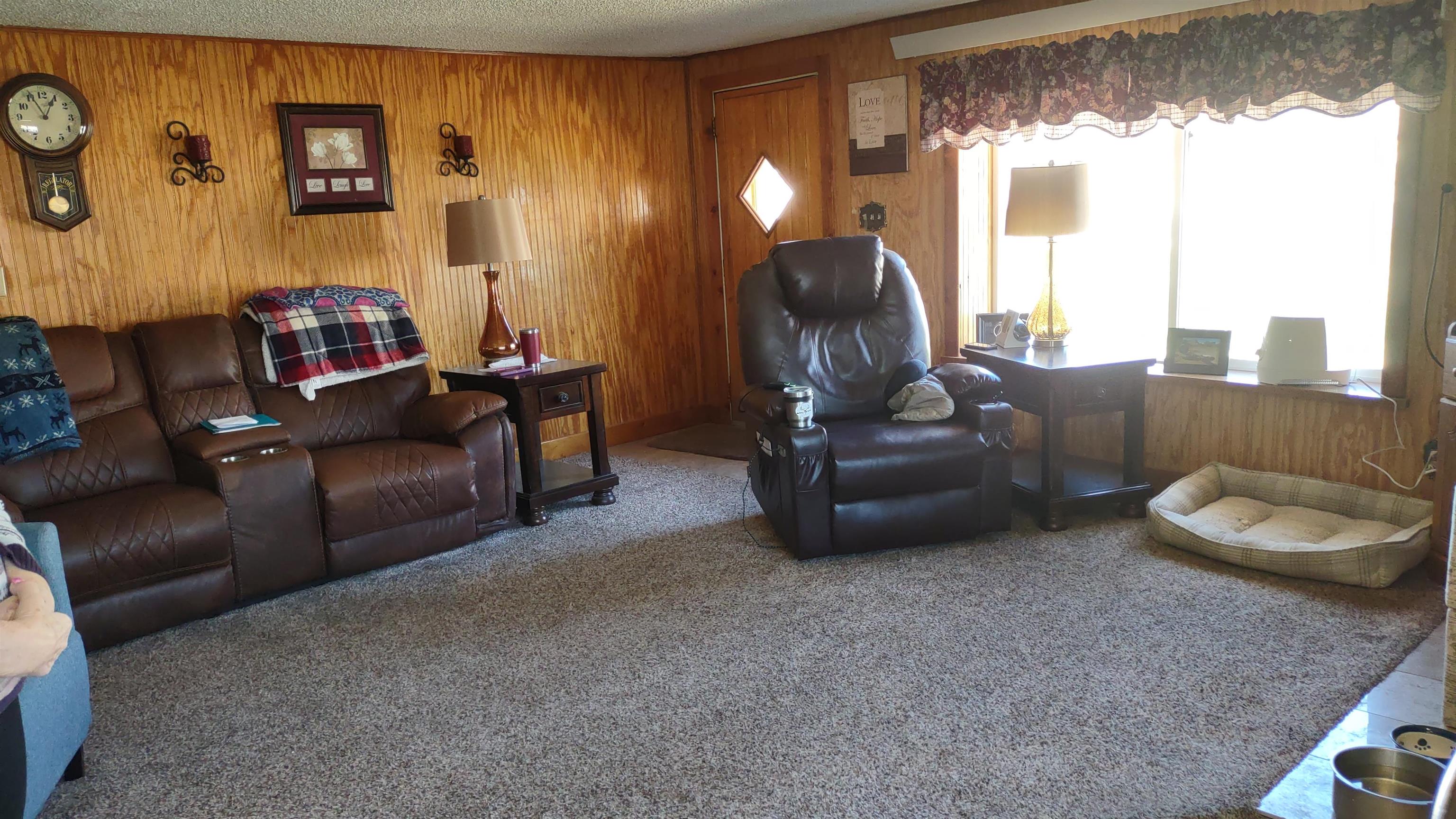 3465 G Road Clifton, CO 81520 - Photo 4 of 18 a living room with furniture and a large window