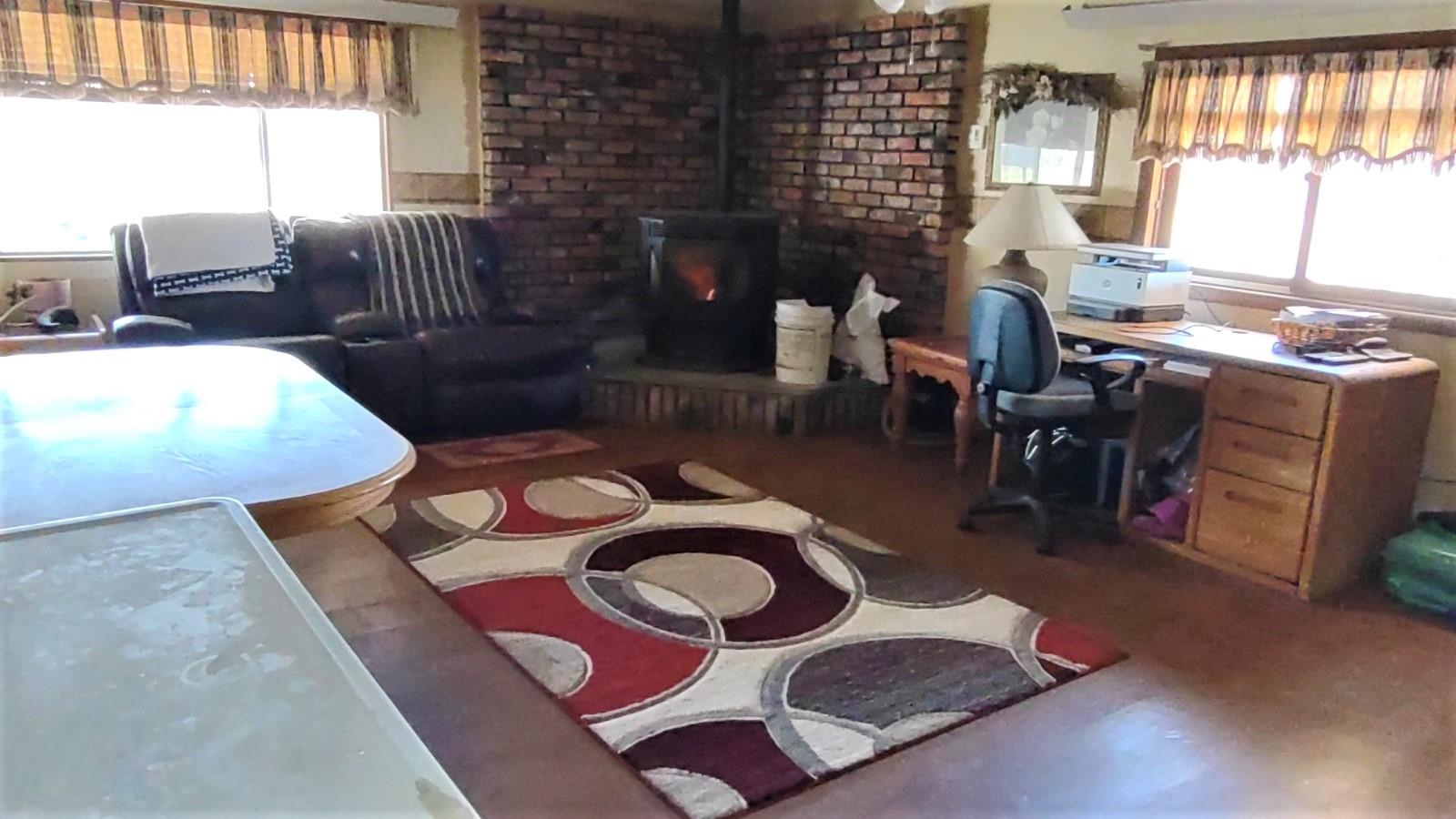 3465 G Road Clifton, CO 81520 - Photo 6 of 18 a living room with furniture and a fireplace