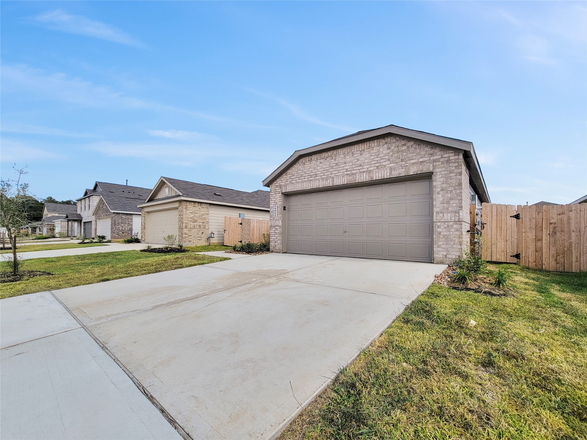 14611 North Ascot Bnd Circle Conroe, TX 77306 - Photo 2 of 16 a front view of a house with a yard