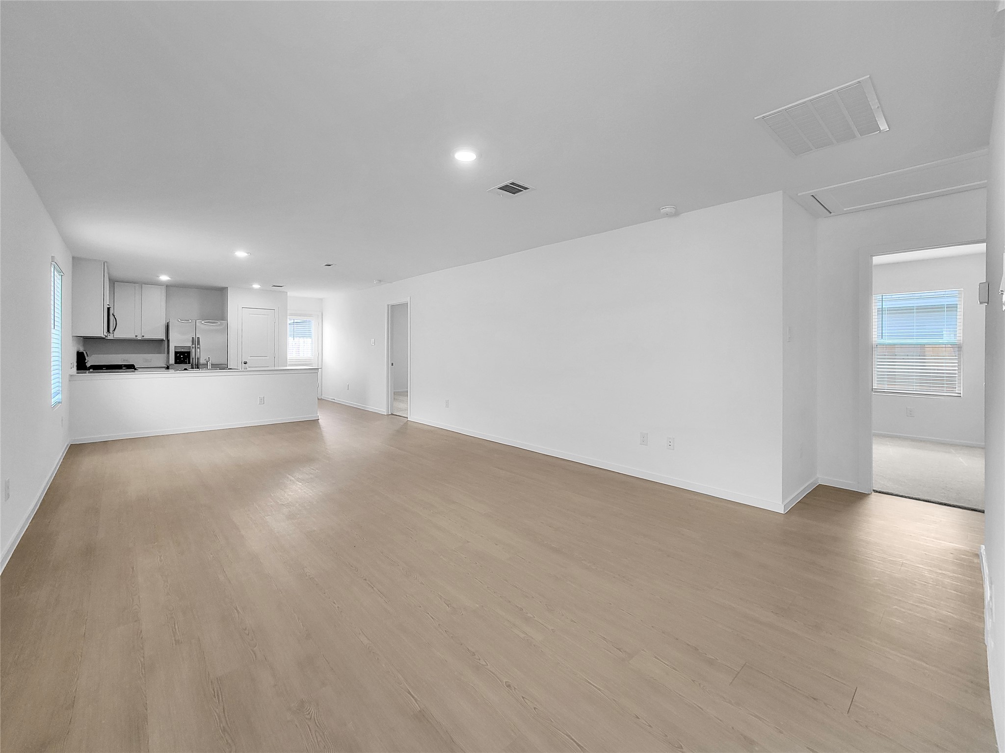 14611 North Ascot Bnd Circle Conroe, TX 77306 - Photo 4 of 16 a view of an empty room with kitchen and window