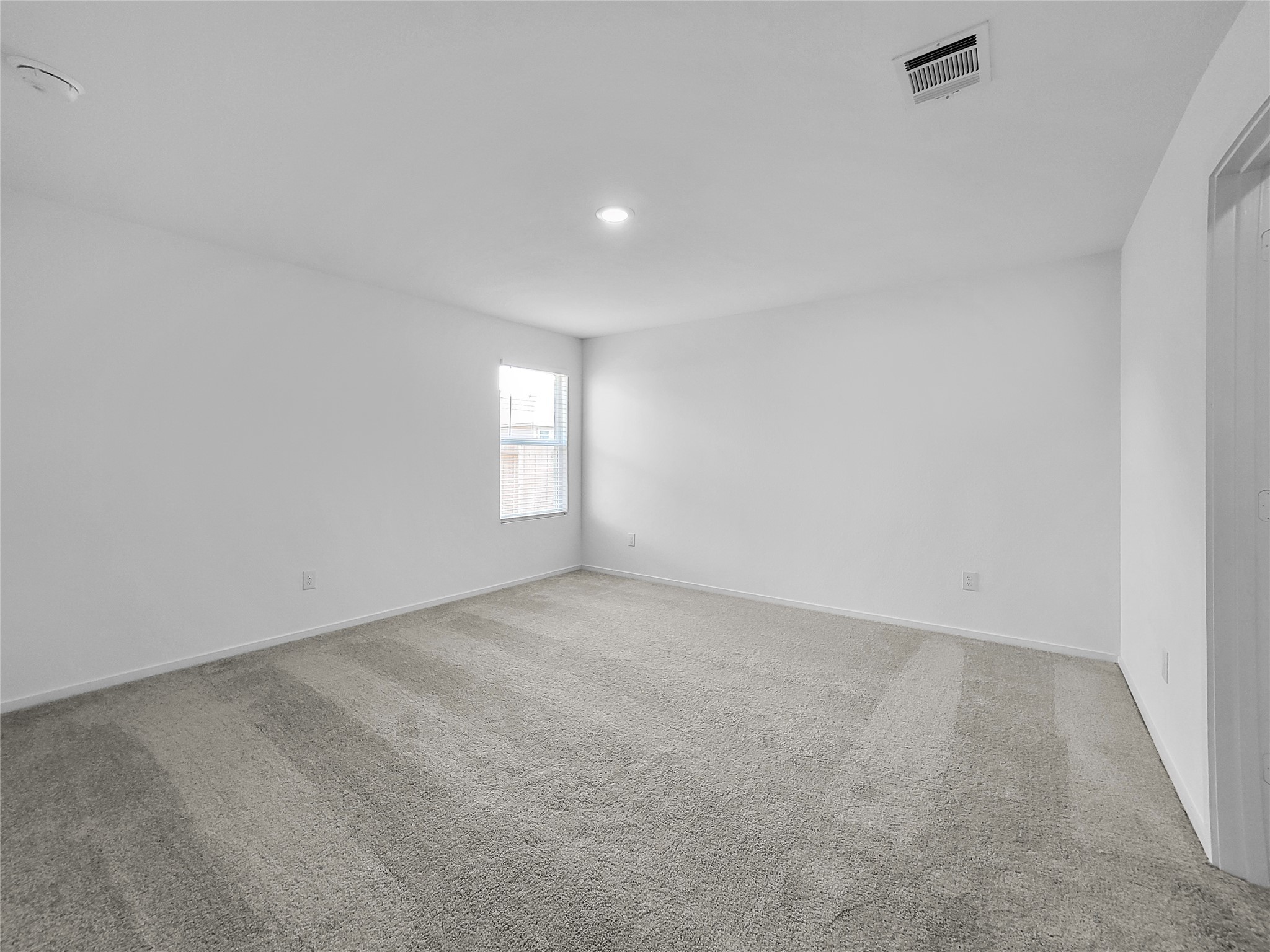 14611 North Ascot Bnd Circle Conroe, TX 77306 - Photo 8 of 16 a view of an empty room with a window