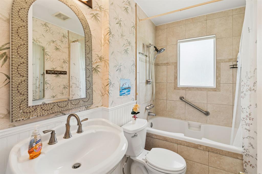 1822 Finley Road Irving, TX 75062 - Photo 30 of 38 a bathroom with a sink toilet and shower