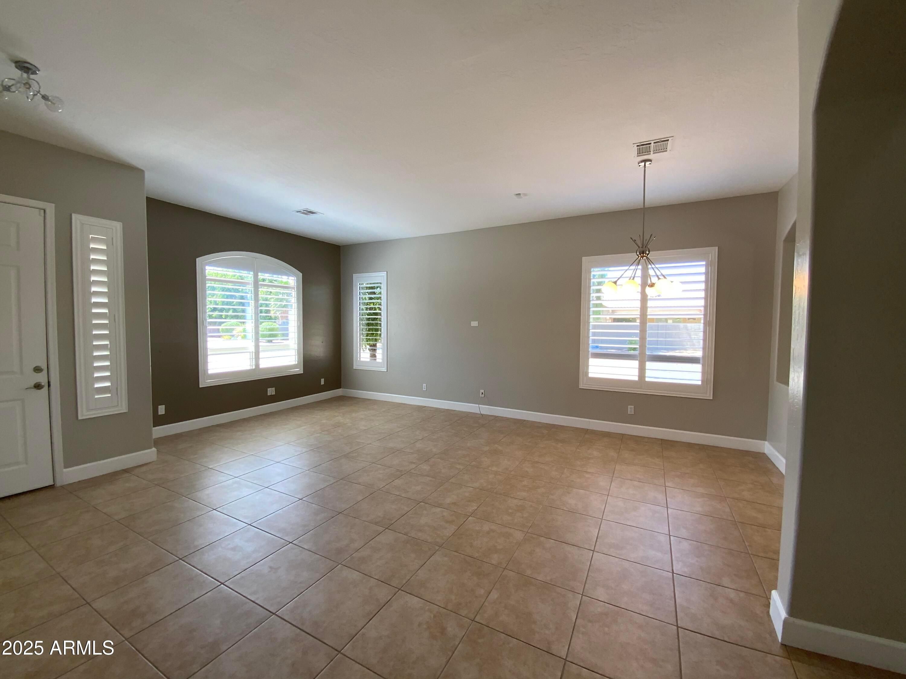 6204 East Phelps Road Scottsdale, AZ 85254 - Photo 11 of 25 a view of an empty room with a window