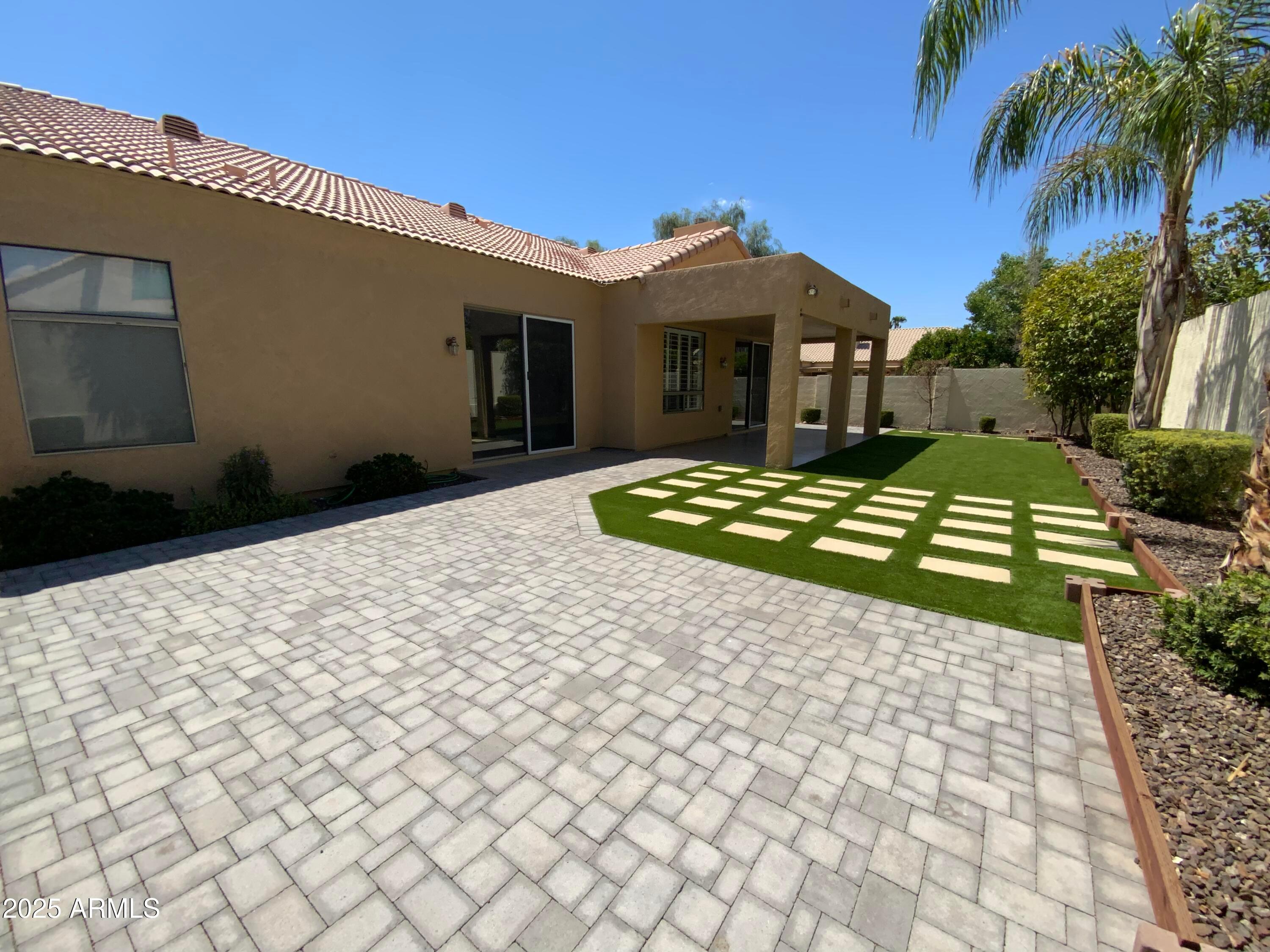 6204 East Phelps Road Scottsdale, AZ 85254 - Photo 24 of 25 a front view of a house with a yard
