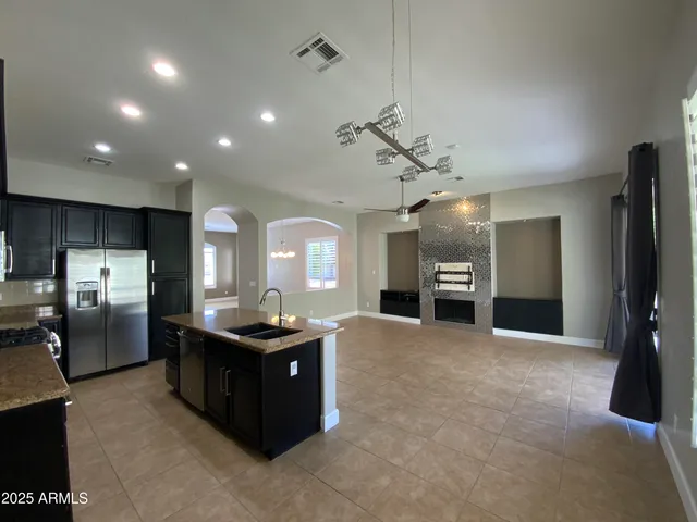 a view of a kitchen with a sink and dishwasher