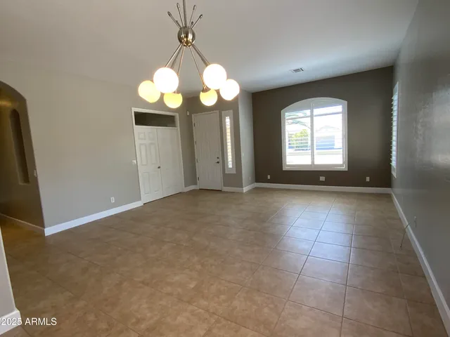 a kitchen with kitchen island granite countertop a sink and cabinets