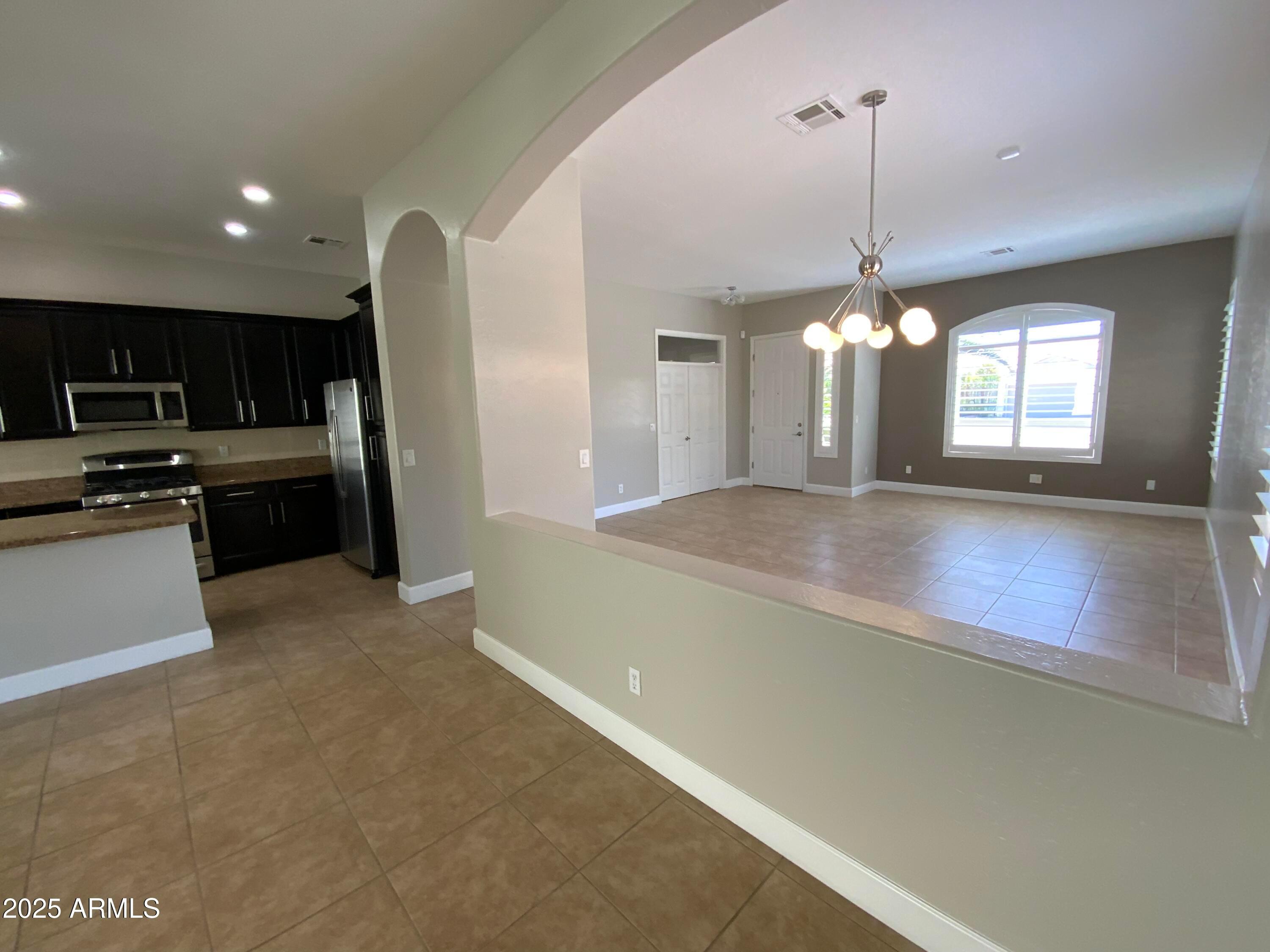6204 East Phelps Road Scottsdale, AZ 85254 - Photo 5 of 25 a view of a kitchen with a sink and dishwasher