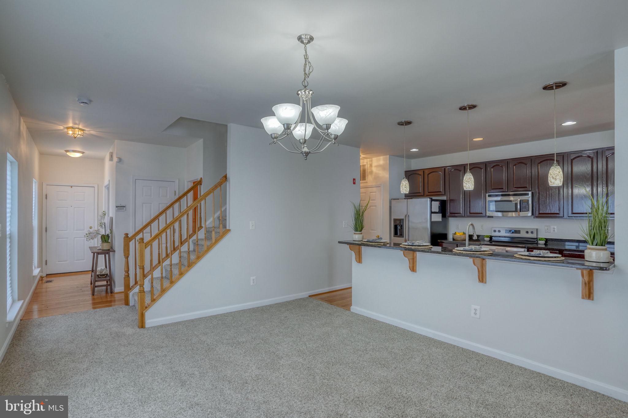 305 Appleby School Road Cambridge, MD 21613 - Photo 11 of 53 a kitchen with stainless steel appliances granite countertop a sink and cabinets