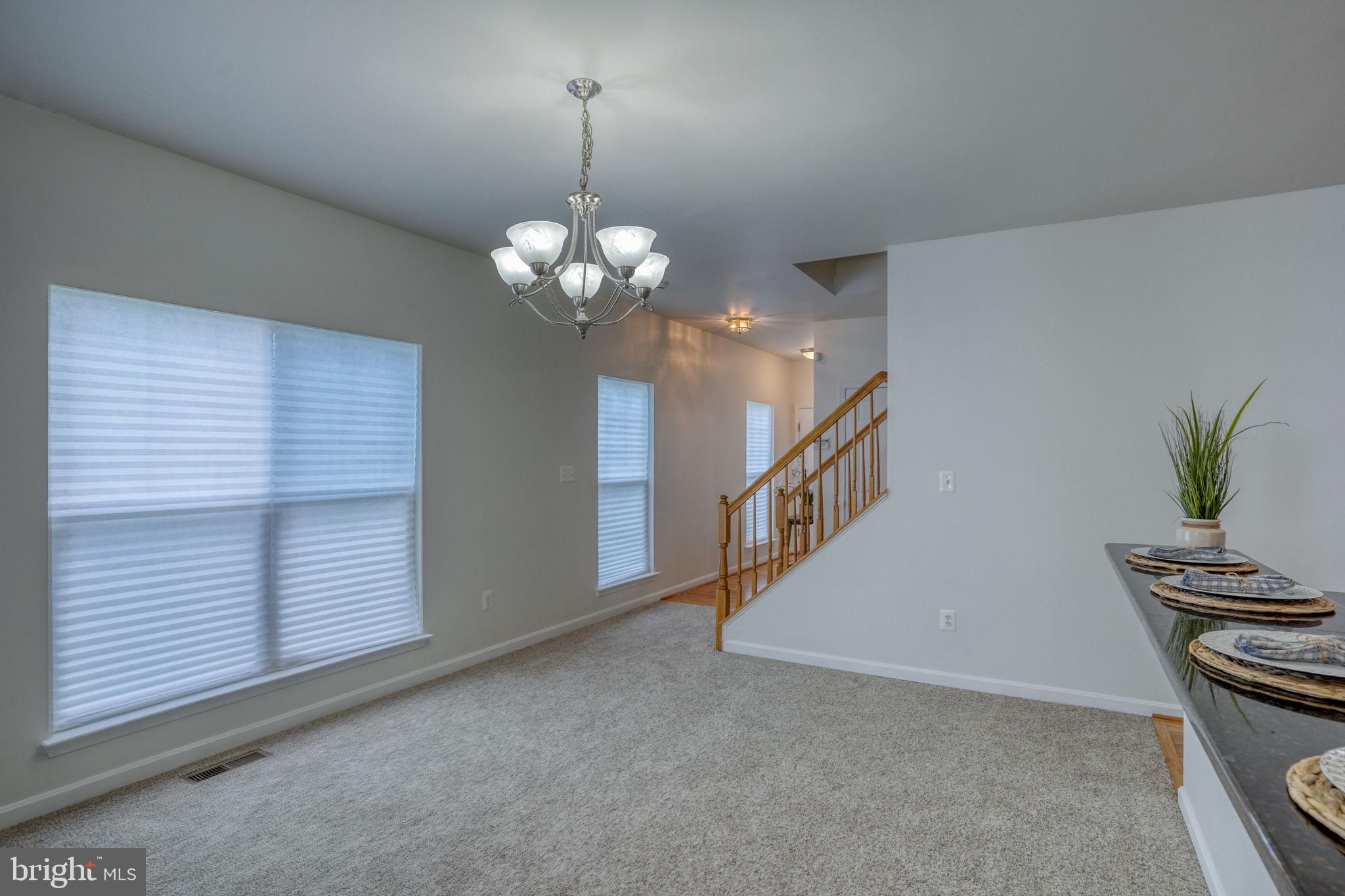 305 Appleby School Road Cambridge, MD 21613 - Photo 12 of 53 a view of a livingroom with a staircase