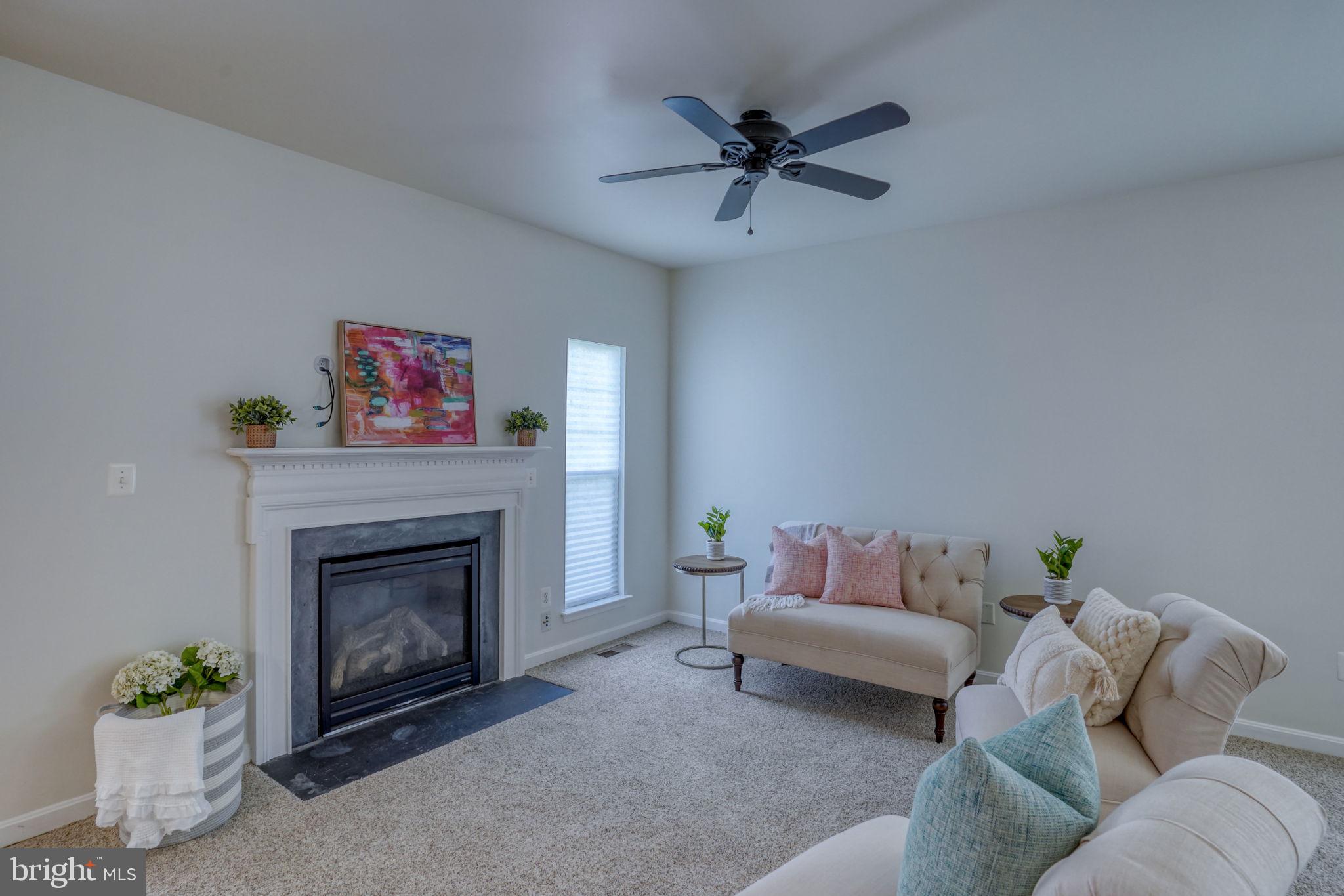 305 Appleby School Road Cambridge, MD 21613 - Photo 13 of 53 a living room with furniture and a fireplace