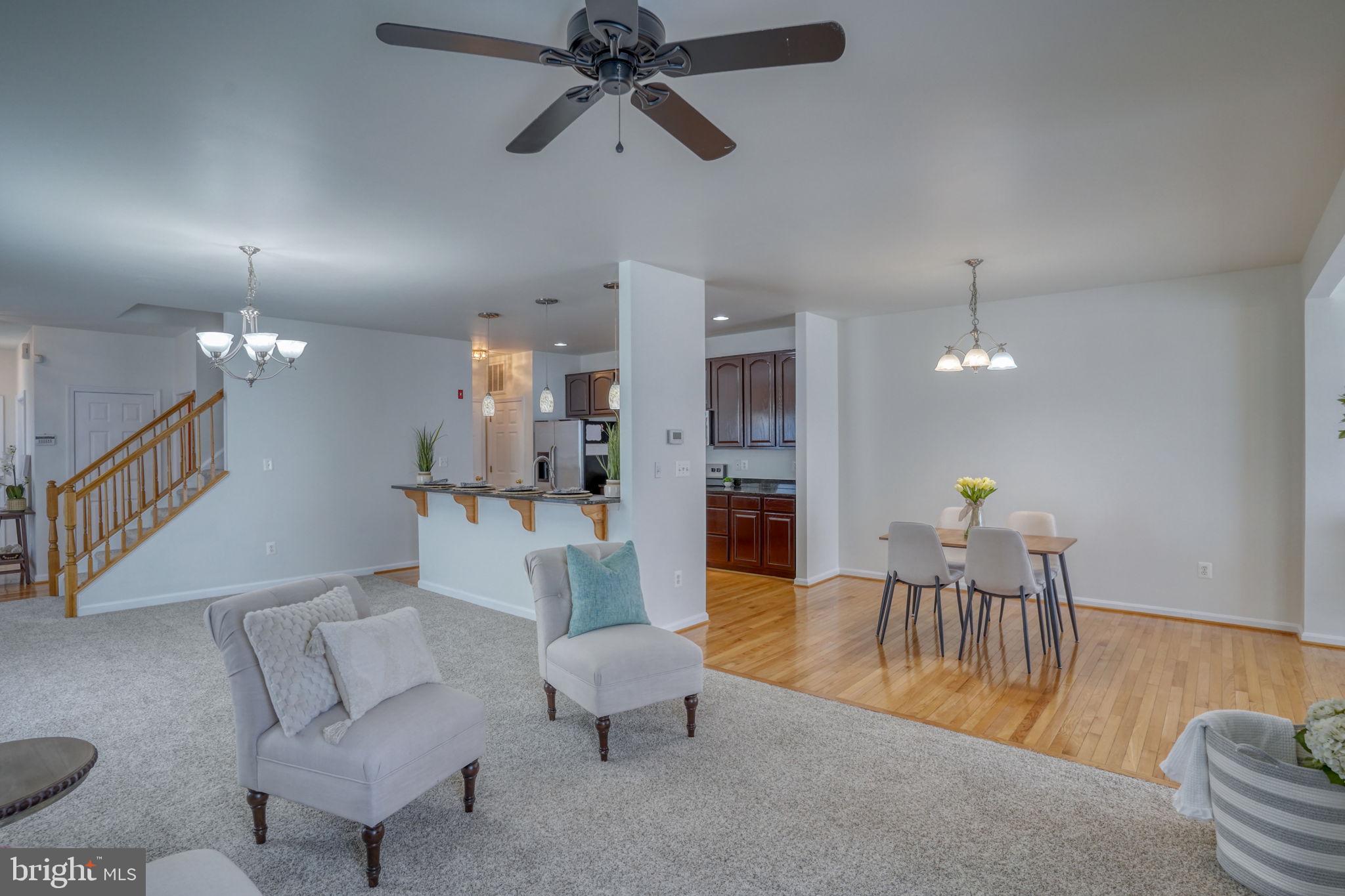 305 Appleby School Road Cambridge, MD 21613 - Photo 14 of 53 a living room with furniture kitchen view and a wooden floor