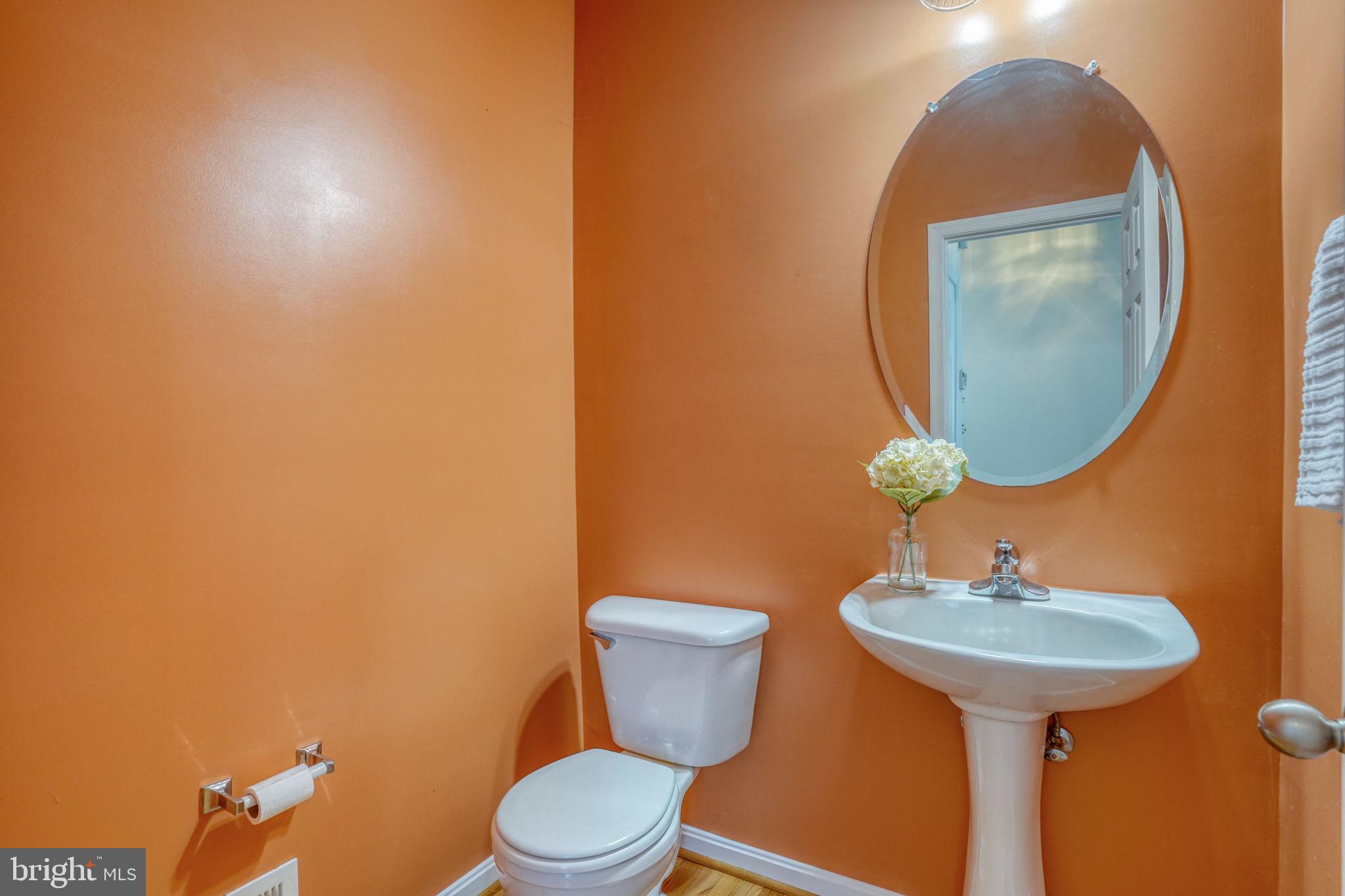 305 Appleby School Road Cambridge, MD 21613 - Photo 27 of 53 a bathroom with a toilet sink and mirror