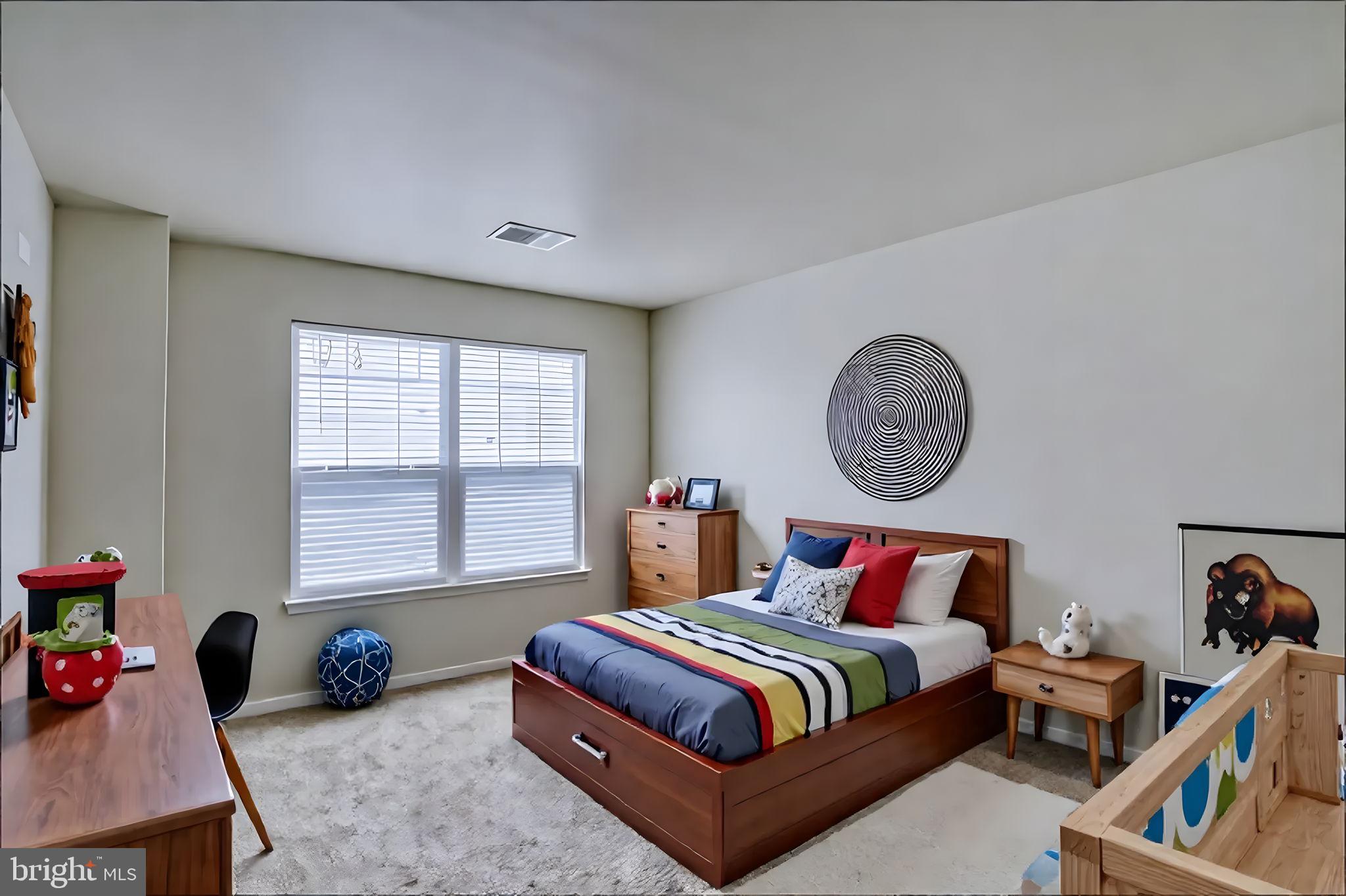 305 Appleby School Road Cambridge, MD 21613 - Photo 41 of 53 a bedroom with a bed a window and a chandelier