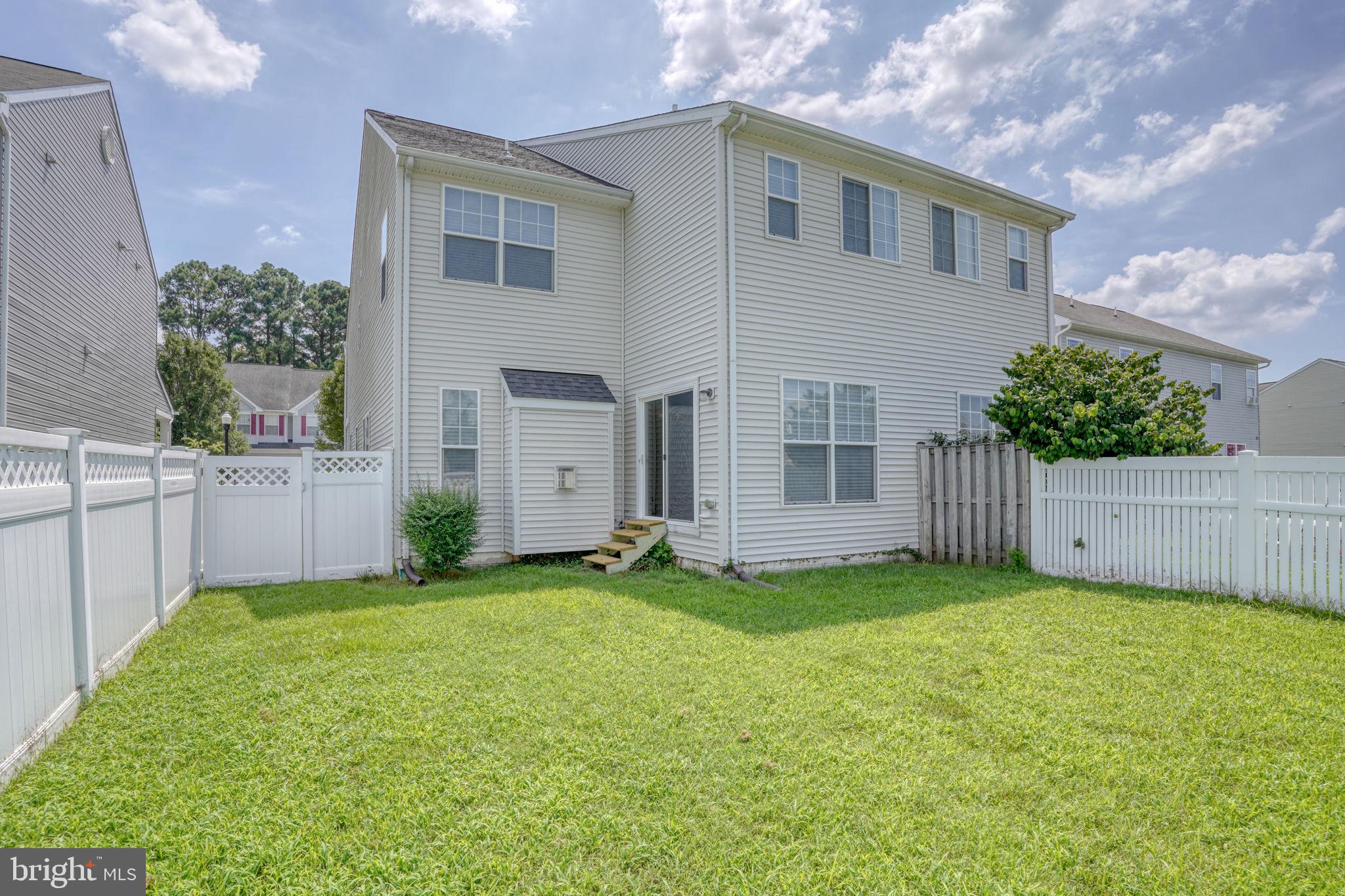 305 Appleby School Road Cambridge, MD 21613 - Photo 45 of 53 a view of a house with a yard and garage