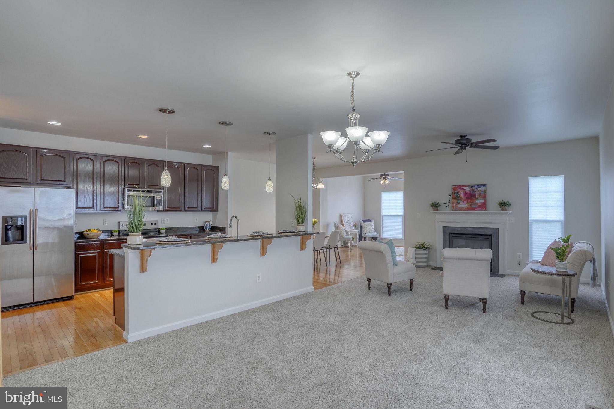 305 Appleby School Road Cambridge, MD 21613 - Photo 8 of 53 a open kitchen with cabinets and a wooden floor