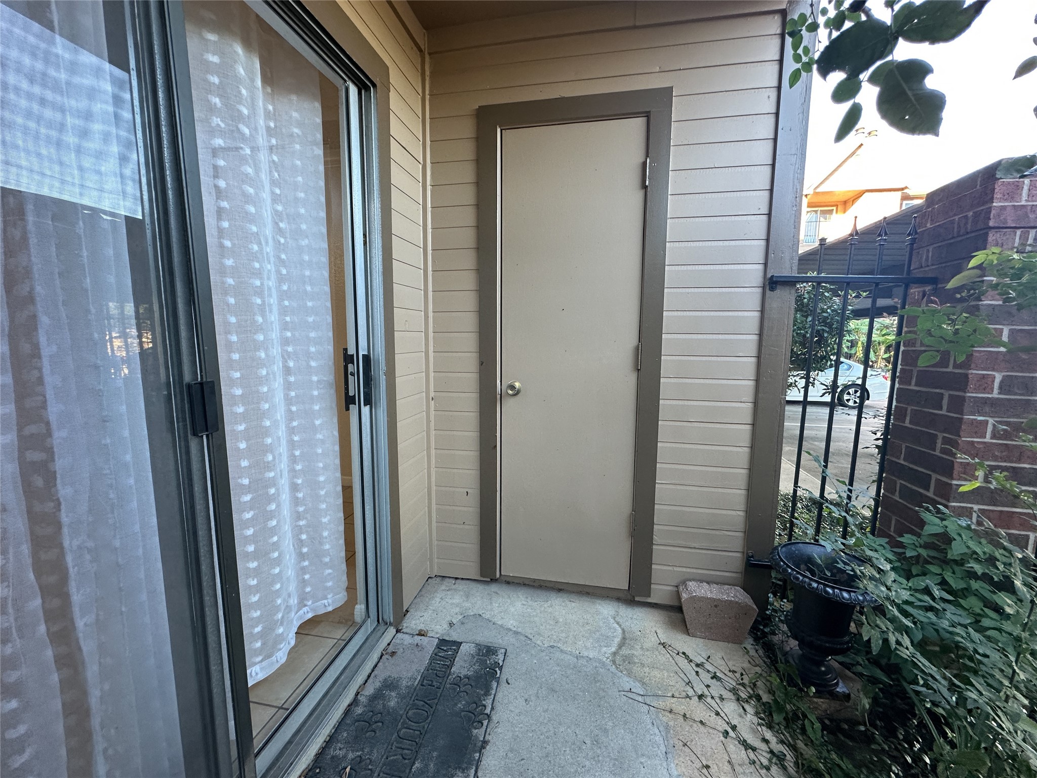 2121 Hepburn Street, Unit 1110 Houston, TX 77054 - Photo 18 of 22 This inviting covered porch offers a cozy retreat with the added ease of a convenient storage closet, perfect for organizing your outdoor essentials.