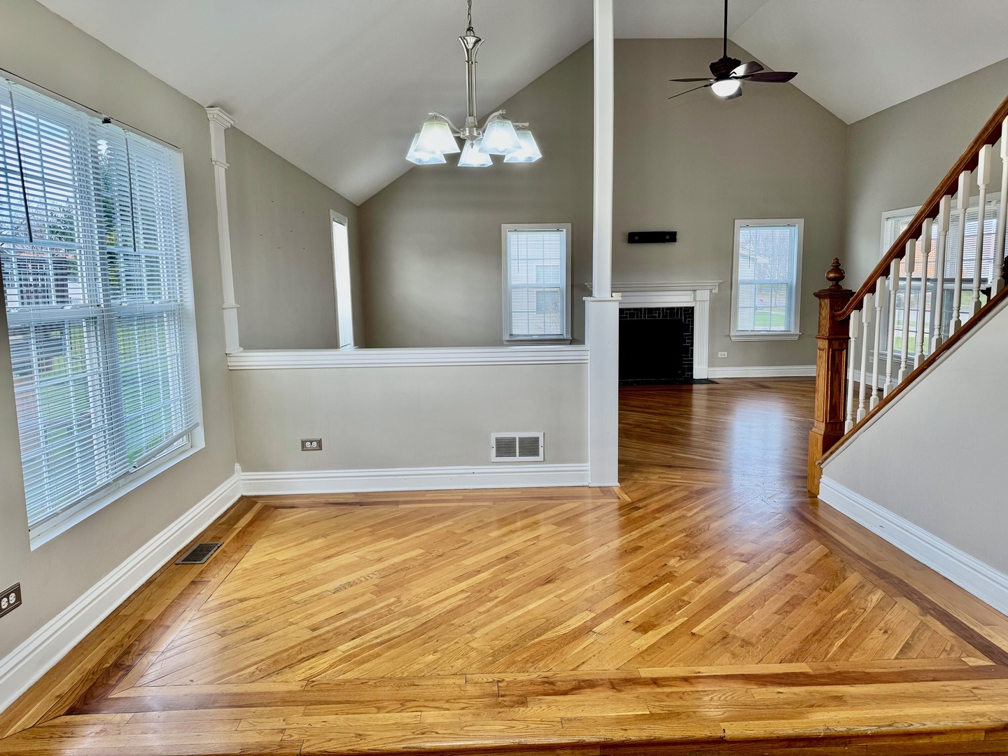 516 Chestnut Lane Peotone, IL 60468 - Photo 12 of 27 a view of a livingroom with wooden floor and a kitchen