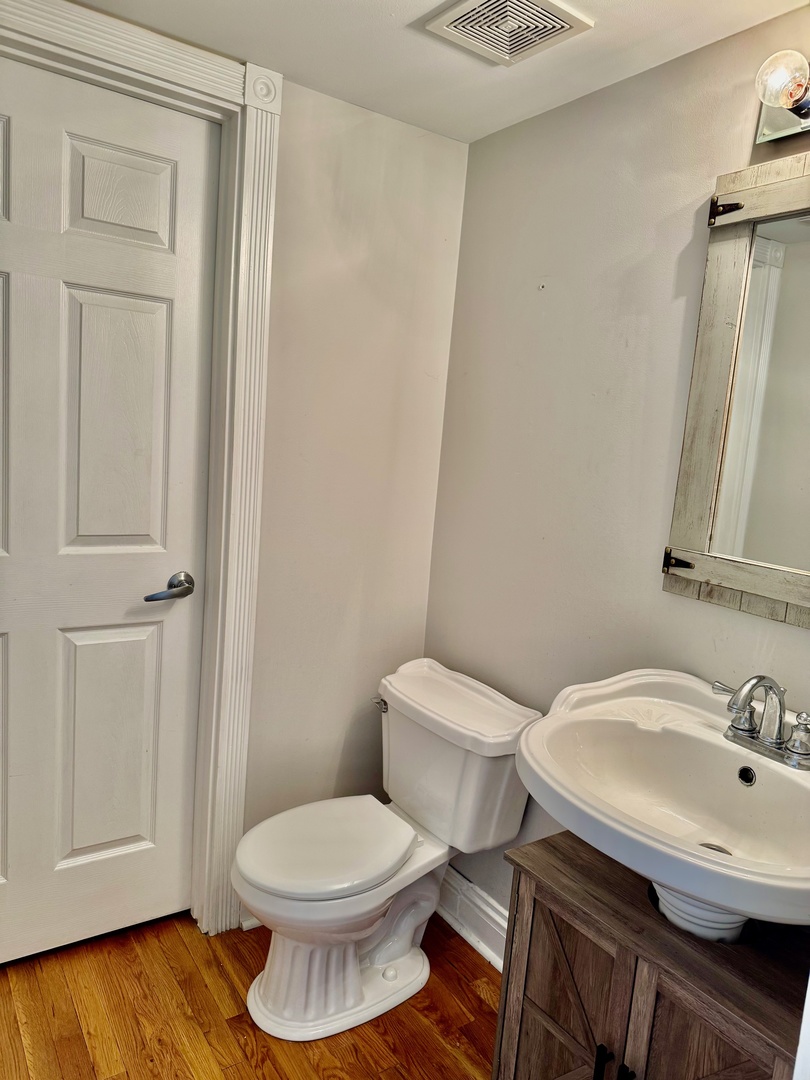 516 Chestnut Lane Peotone, IL 60468 - Photo 22 of 27 a bathroom with a sink a toilet and shower