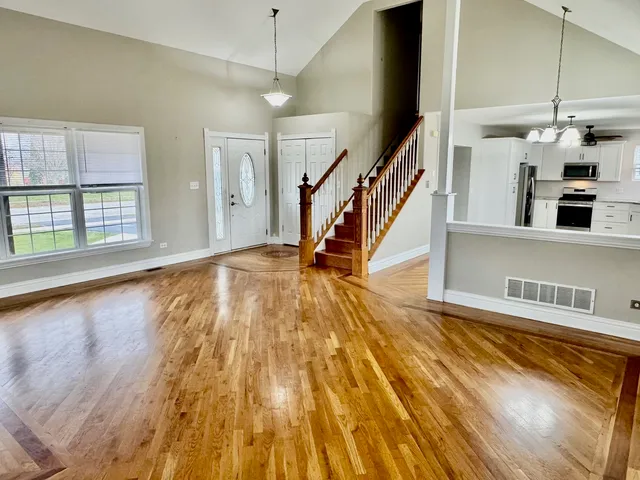 a view of an entryway with wooden floor
