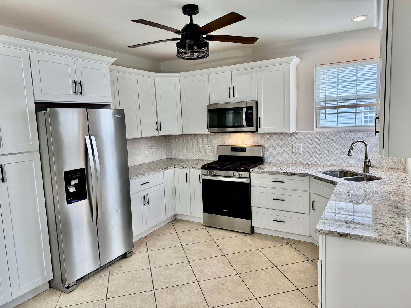 516 Chestnut Lane Peotone, IL 60468 - Photo 9 of 27 a kitchen with stainless steel appliances a refrigerator sink and microwave