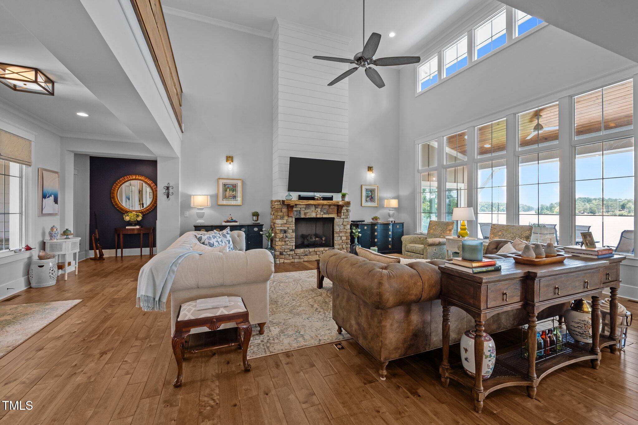 976 Estate Road Semora, NC 27343 - Photo 16 of 74 a living room with fireplace furniture and a flat screen tv