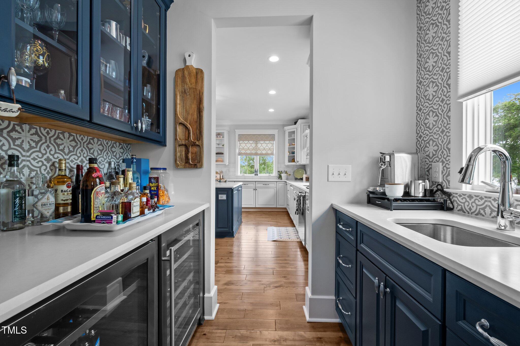 976 Estate Road Semora, NC 27343 - Photo 25 of 74 a kitchen with a sink cabinets and a stove top oven