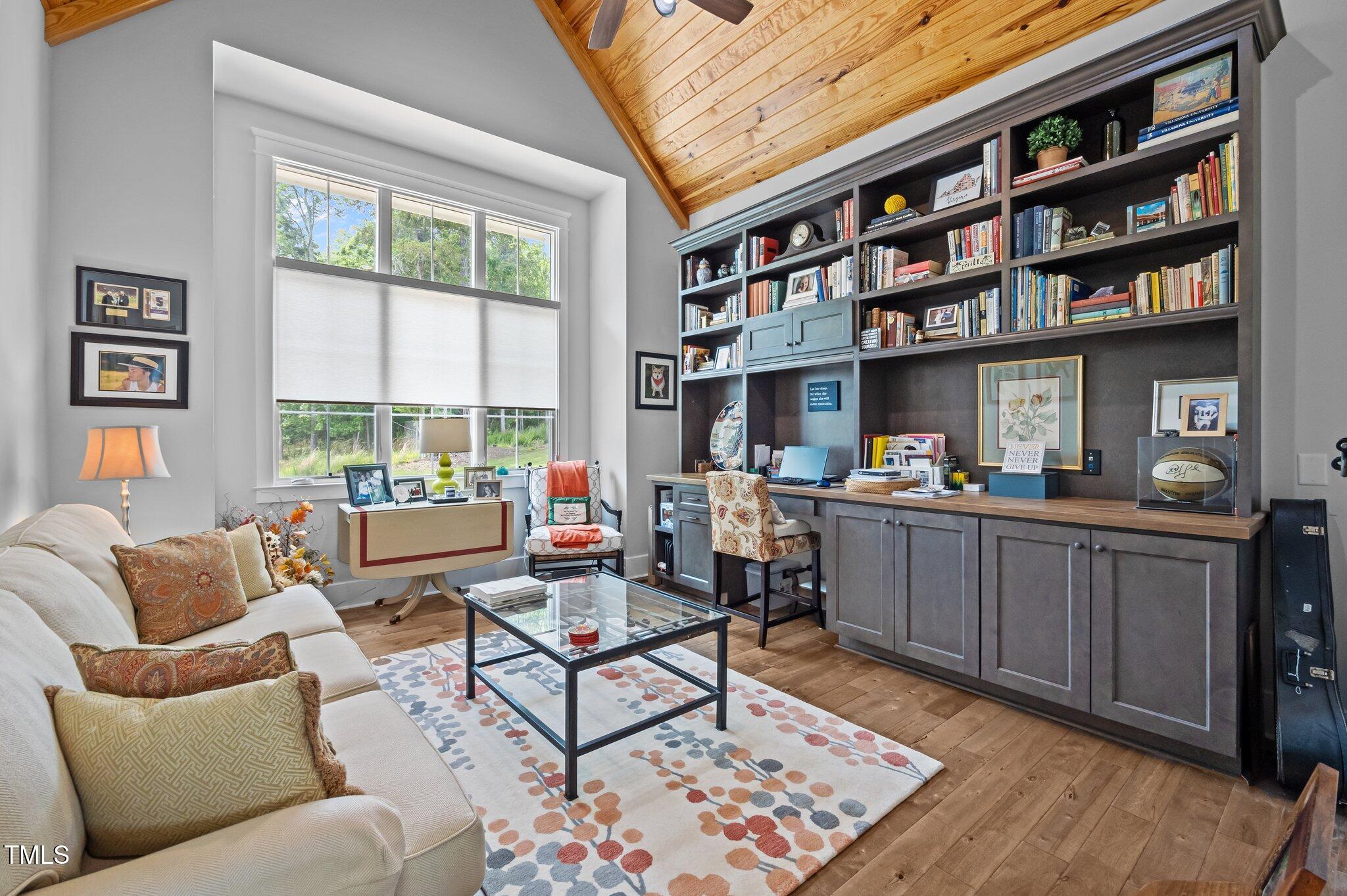 976 Estate Road Semora, NC 27343 - Photo 30 of 74 a living room with furniture and a book shelf