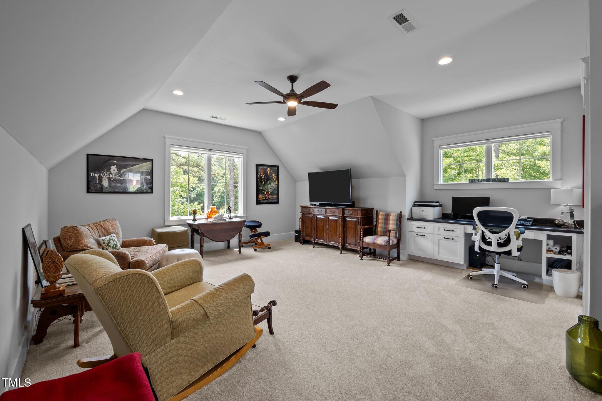 976 Estate Road Semora, NC 27343 - Photo 48 of 74 a living room with furniture and a flat screen tv