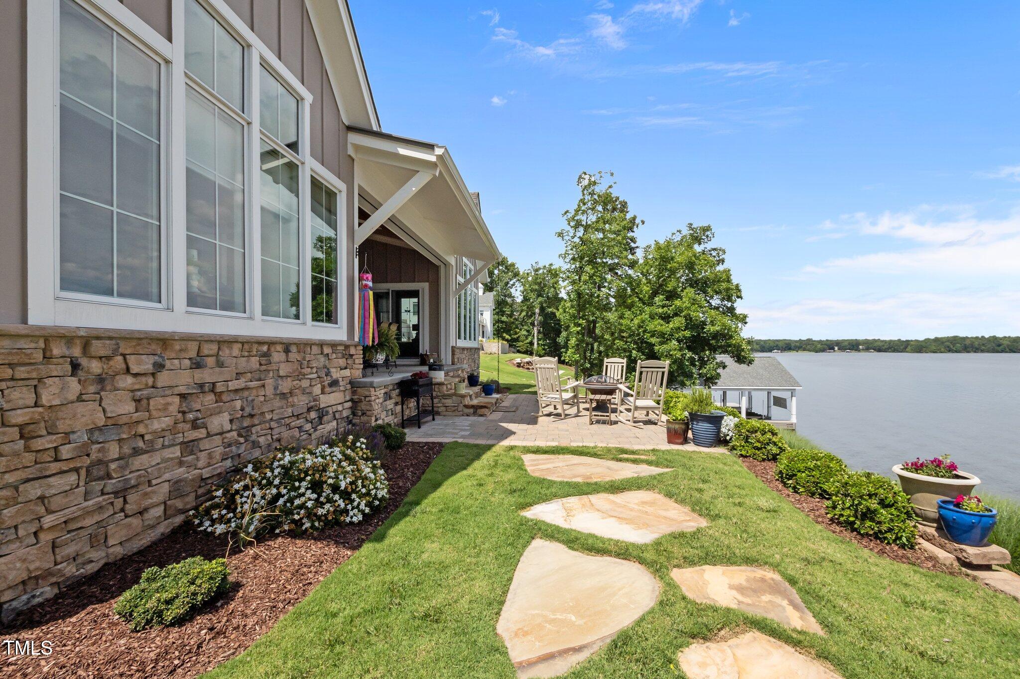 976 Estate Road Semora, NC 27343 - Photo 52 of 74 a front view of a house with garden