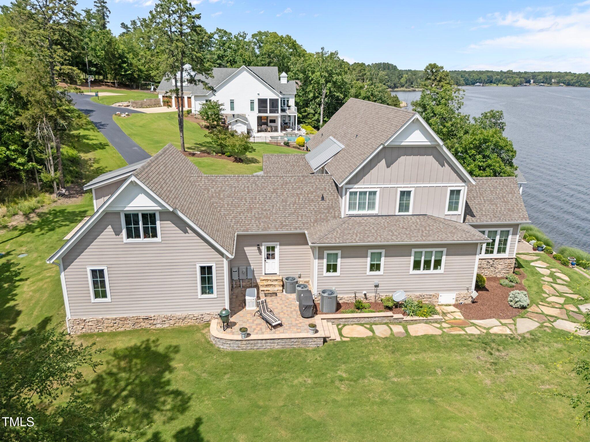 976 Estate Road Semora, NC 27343 - Photo 54 of 74 a aerial view of a house with swimming pool and a yard