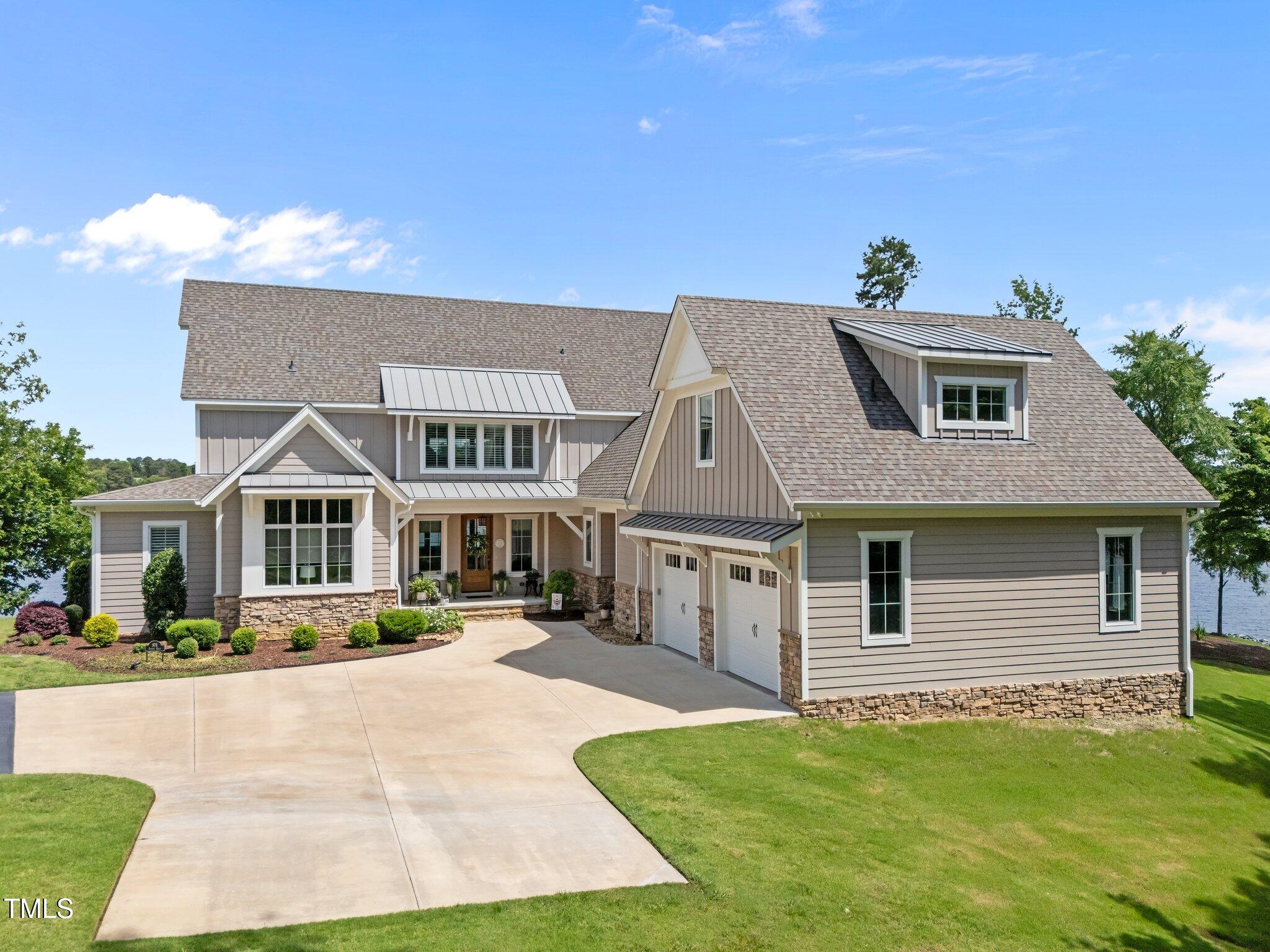 976 Estate Road Semora, NC 27343 - Photo 5 of 74 a front view of a house with a yard