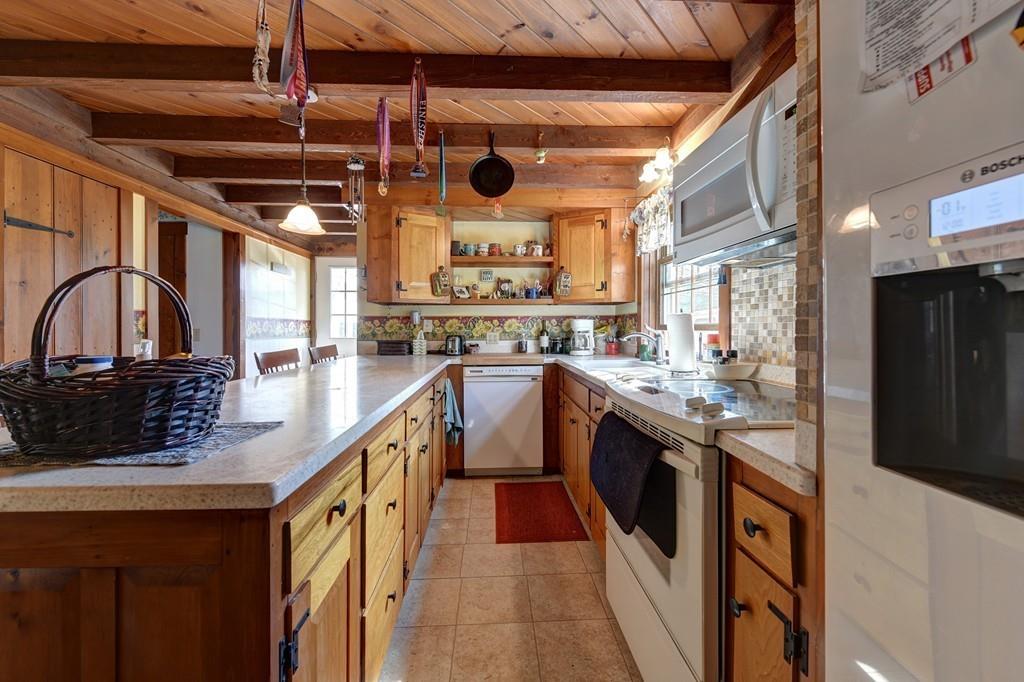 440 Huntington Road Worthington, MA 01098 - Photo 15 of 34 a kitchen with stainless steel appliances granite countertop a stove a sink and a refrigerator