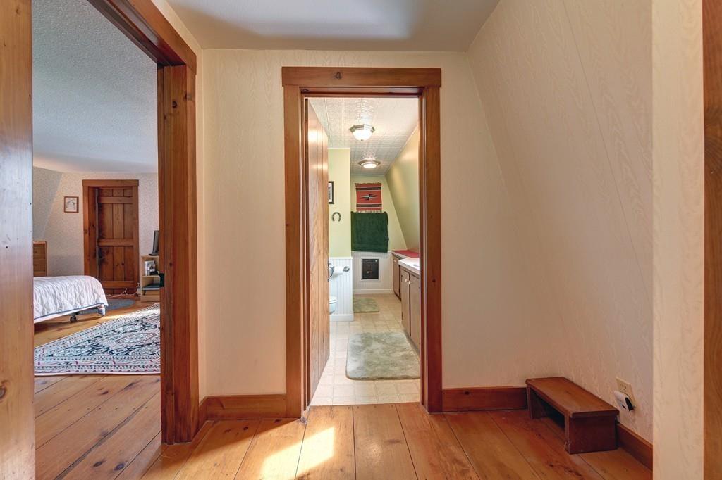 440 Huntington Road Worthington, MA 01098 - Photo 18 of 34 a view of a hallway with wooden floor and bedroom