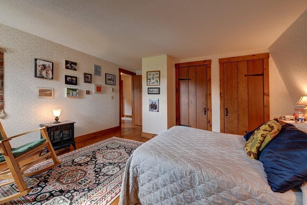 440 Huntington Road Worthington, MA 01098 - Photo 20 of 34 a bedroom with a bed and a refrigerator