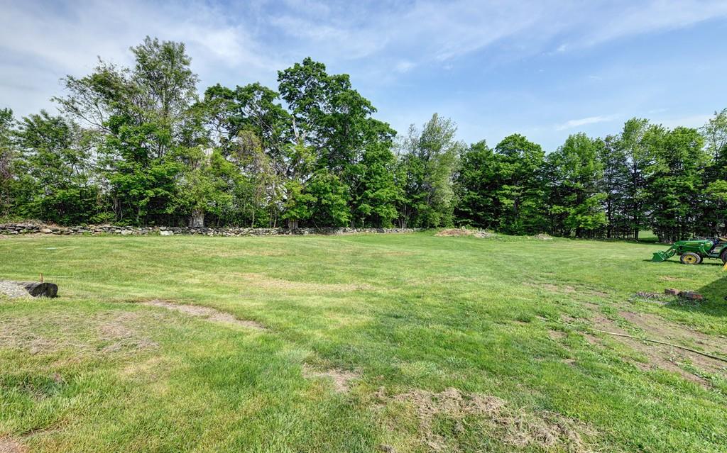 440 Huntington Road Worthington, MA 01098 - Photo 34 of 34 a view of a grassy field with trees in the background
