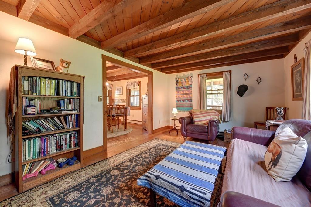 440 Huntington Road Worthington, MA 01098 - Photo 10 of 34 a living room with furniture a rug and a book shelf