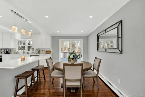a dining room with furniture and window