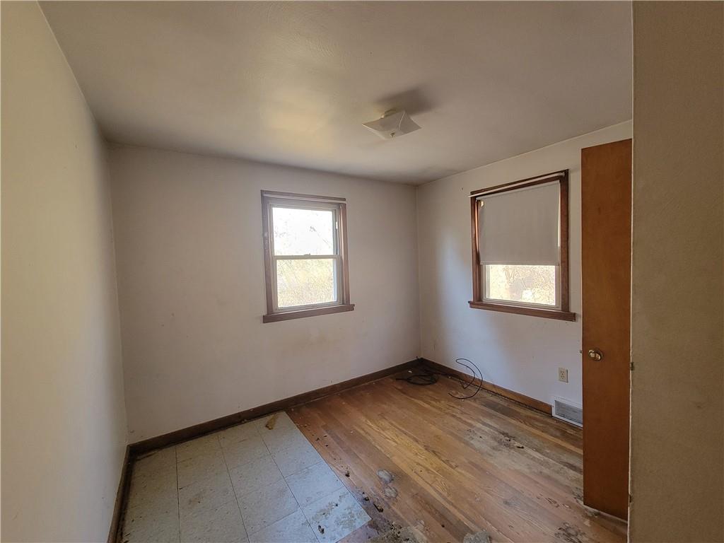 343 Thomas Street Carnegie, PA 15106 - Photo 5 of 9 a view of an empty room with wooden floor and a window