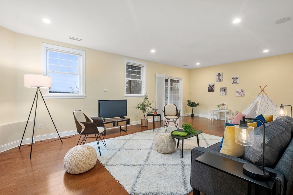 24 Crescent Road, Unit 1 Needham, MA 02494 - Photo 13 of 20 a living room with furniture and a wooden floor