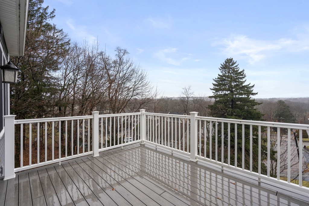 24 Crescent Road, Unit 1 Needham, MA 02494 - Photo 16 of 20 a balcony with wooden floor and fence