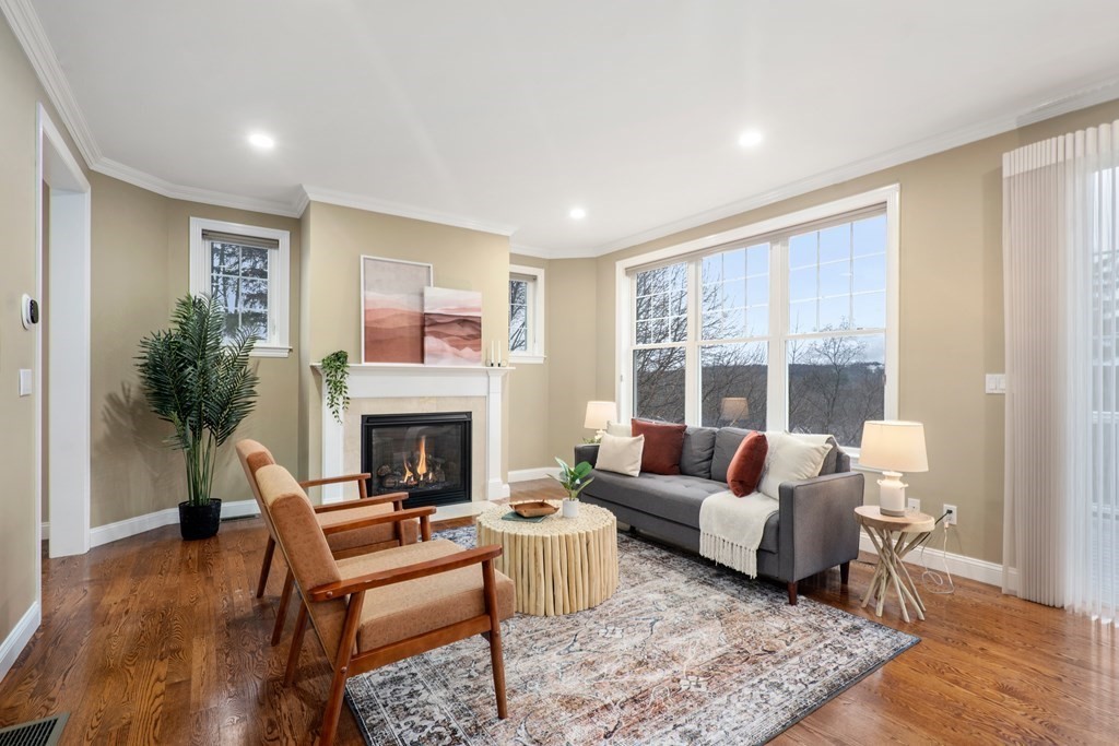 24 Crescent Road, Unit 1 Needham, MA 02494 - Photo 2 of 20 a living room with furniture fireplace and window